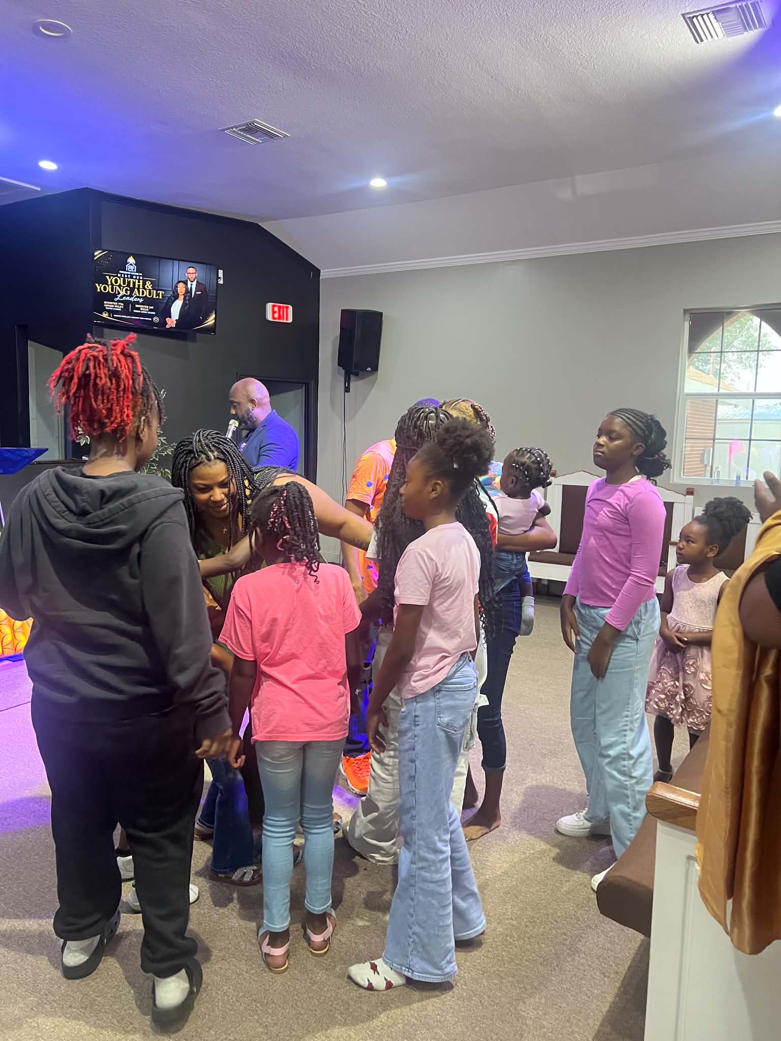 Children and families gathering at The Presence House PC